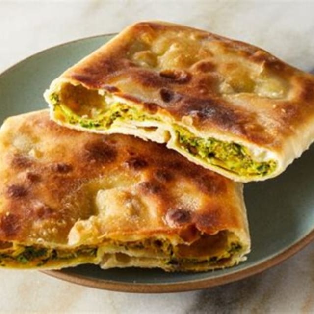 Mughlai Paratha (2) with Yogurt and Pickle.
